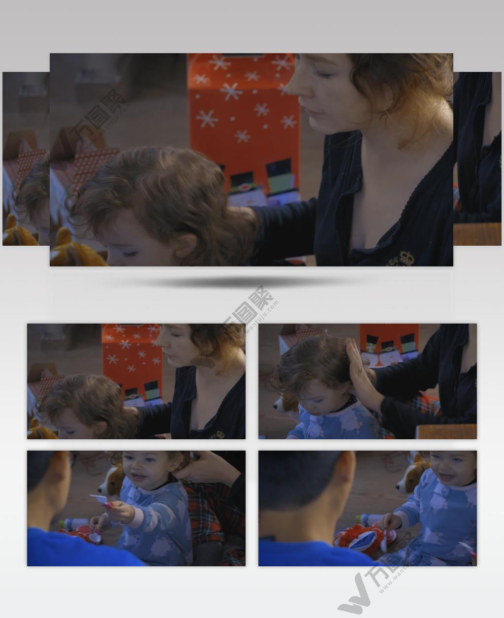 母亲梳理她的小女儿坐在地板上