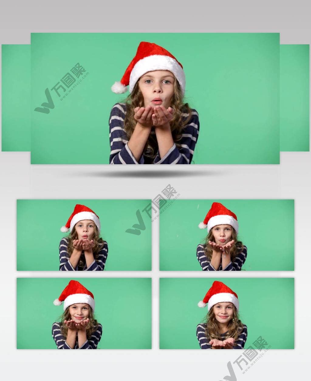 带圣诞帽的女孩在吹纸屑