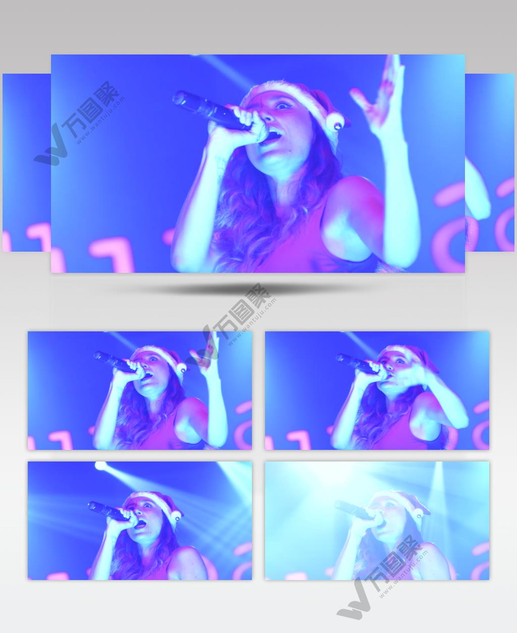 戴着圣诞帽，一手拿着麦克风的舞台上的歌手