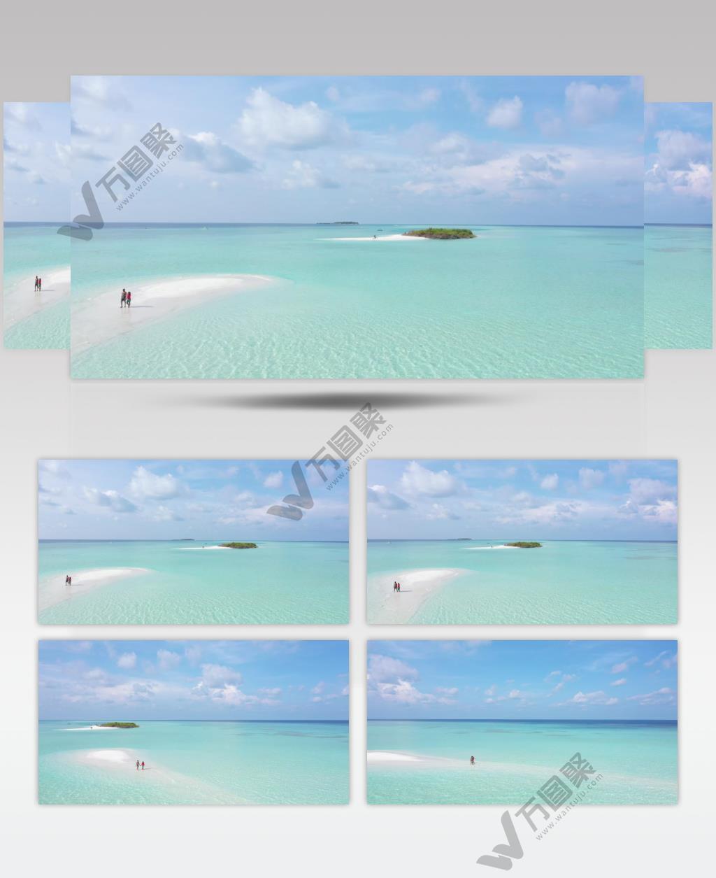 绿松石海，一对夫妇漫步在被海水覆盖的沙滩上