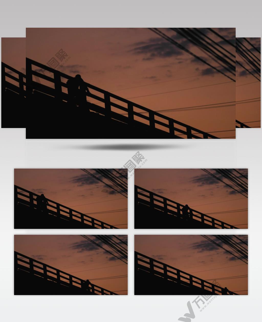 在日落日出之下，在桥上骑车经过的人