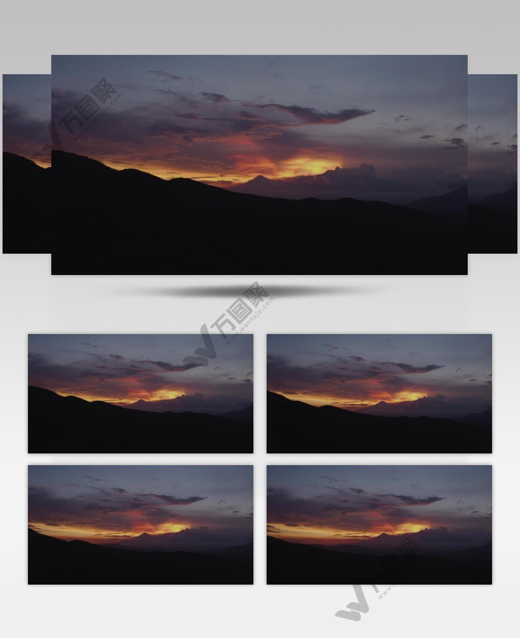 实拍地平线上群山的日落