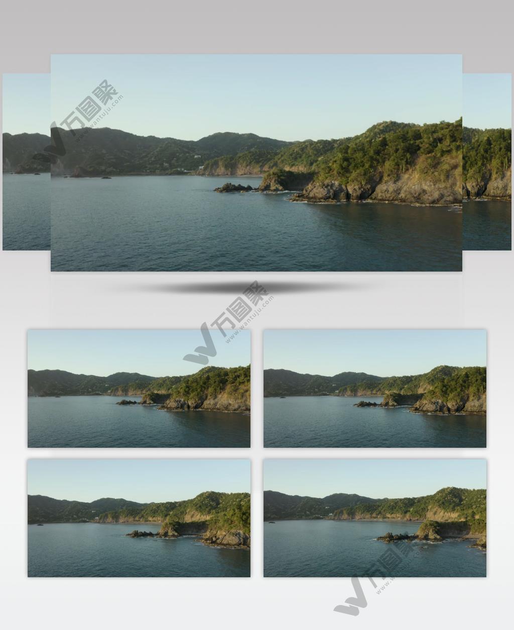 航拍在阳光明媚的日子绕海岸线