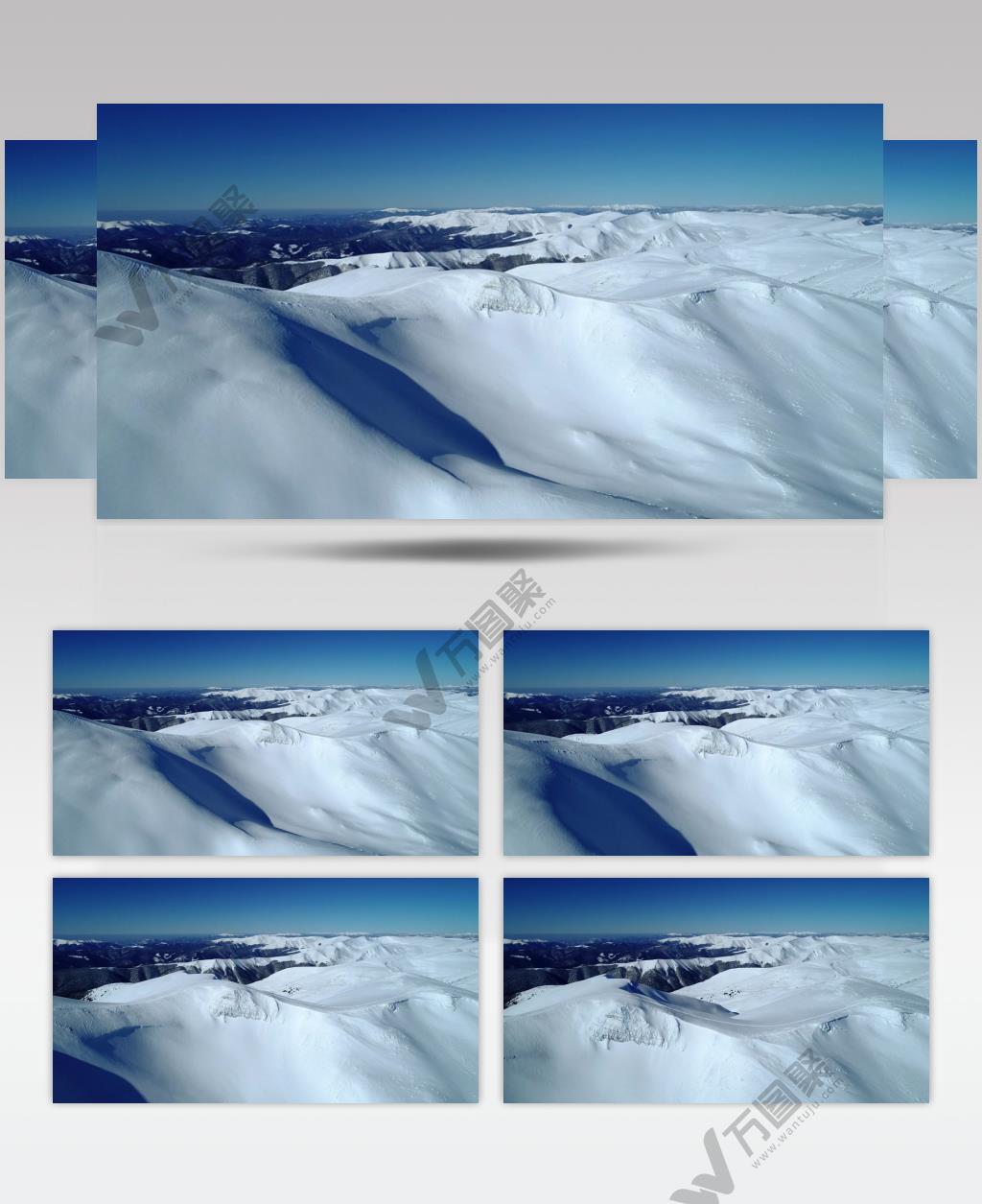  航拍镜头冬天晴天山间雪山