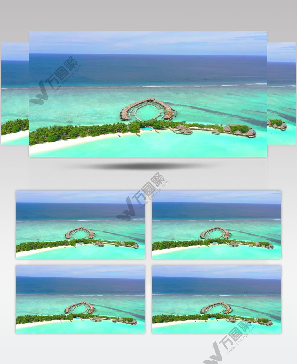 航拍镜头在天堂海滩的一个岛屿上的平房高跷房子