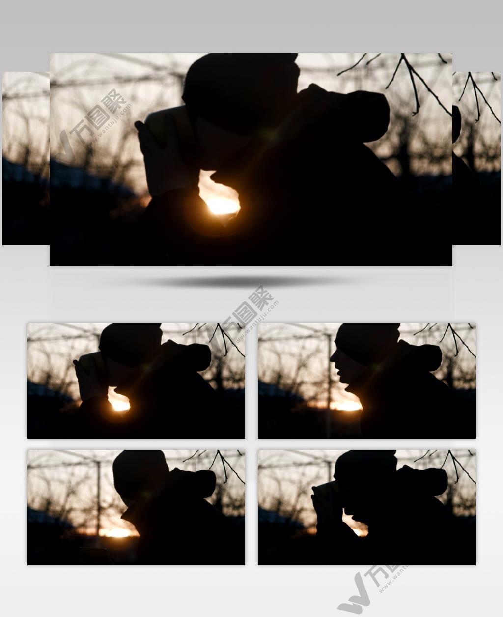 一个人在日落时喝咖啡的剪影