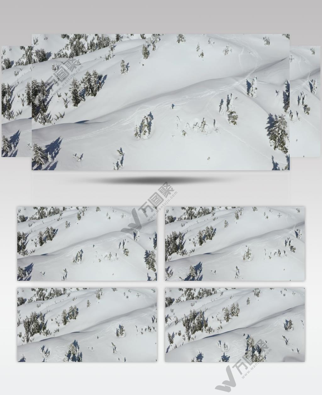 航拍冬季雪山山脉上的滑雪爱好者实拍视频