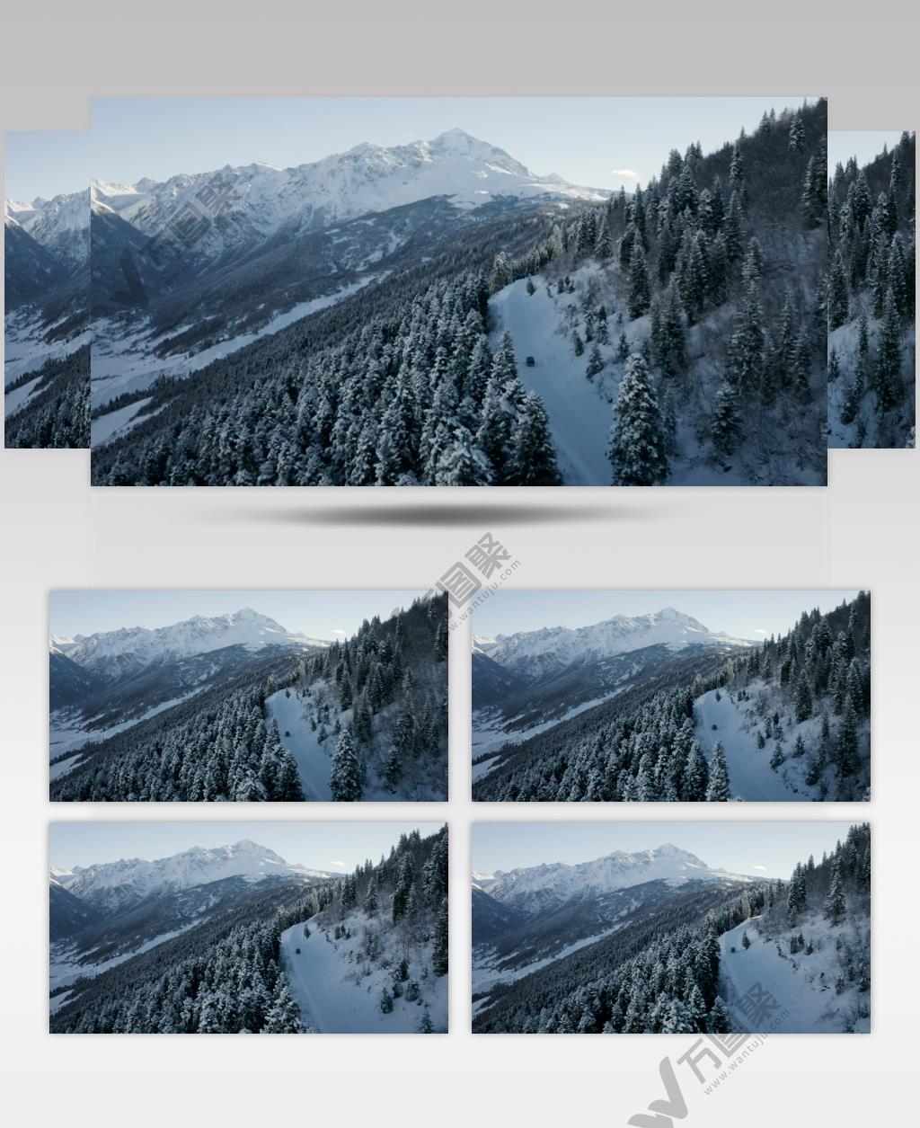 航拍冬季山脉森林里的汽车行驶实拍视频