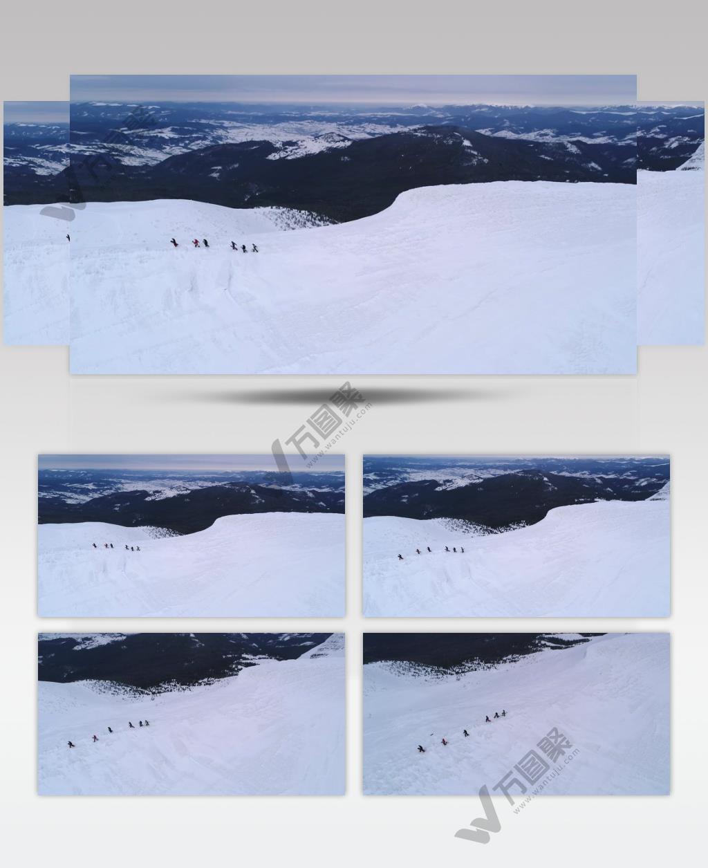 航拍滑雪爱好者在雪地里行走实拍视频