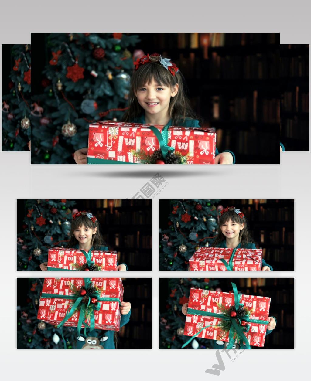 快乐的小女孩挥舞着她的圣诞礼物