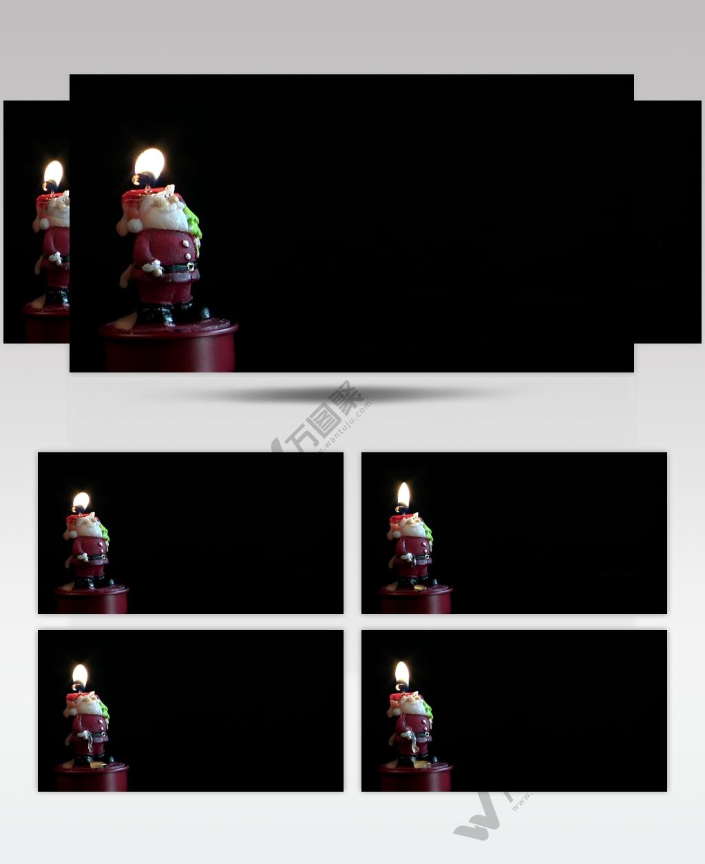 圣诞节黑暗背景前的圣诞老人蜡烛