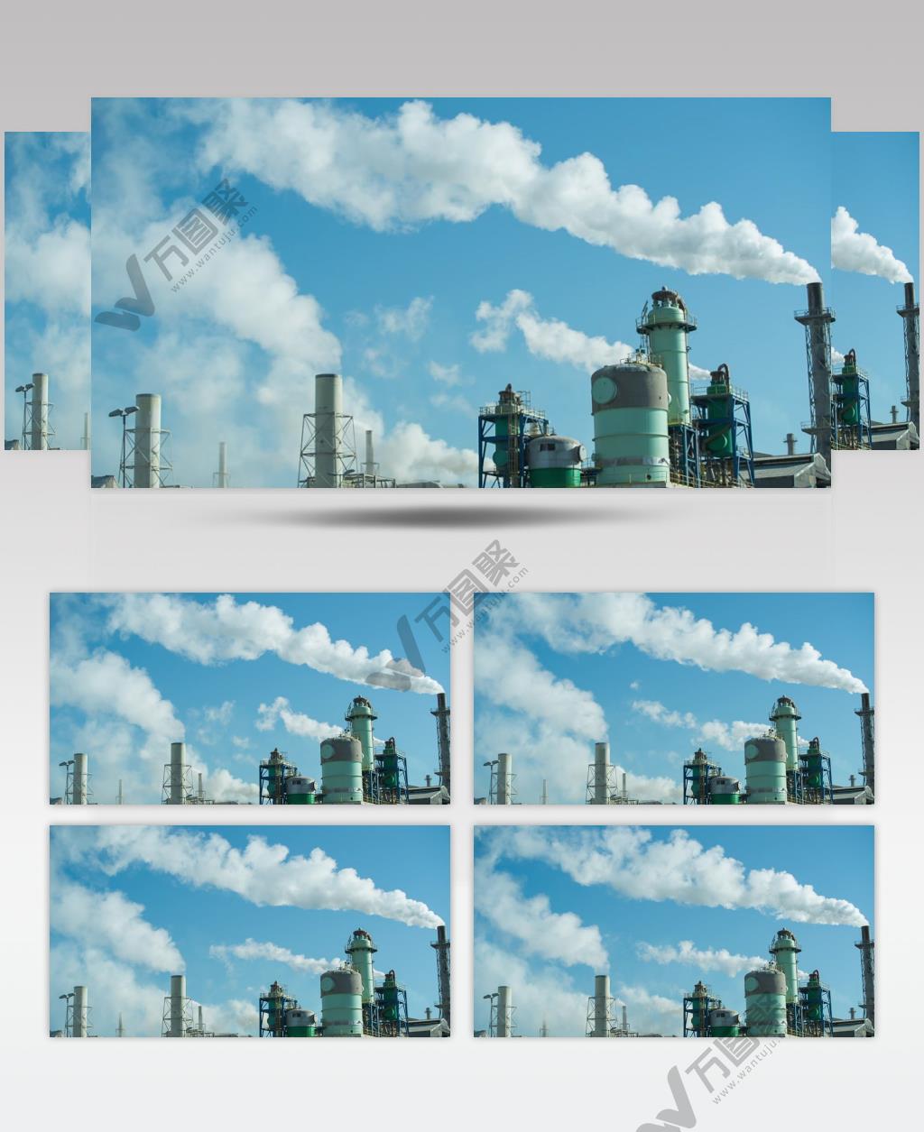 蓝天下正在生产的工业厂房冒出的白烟