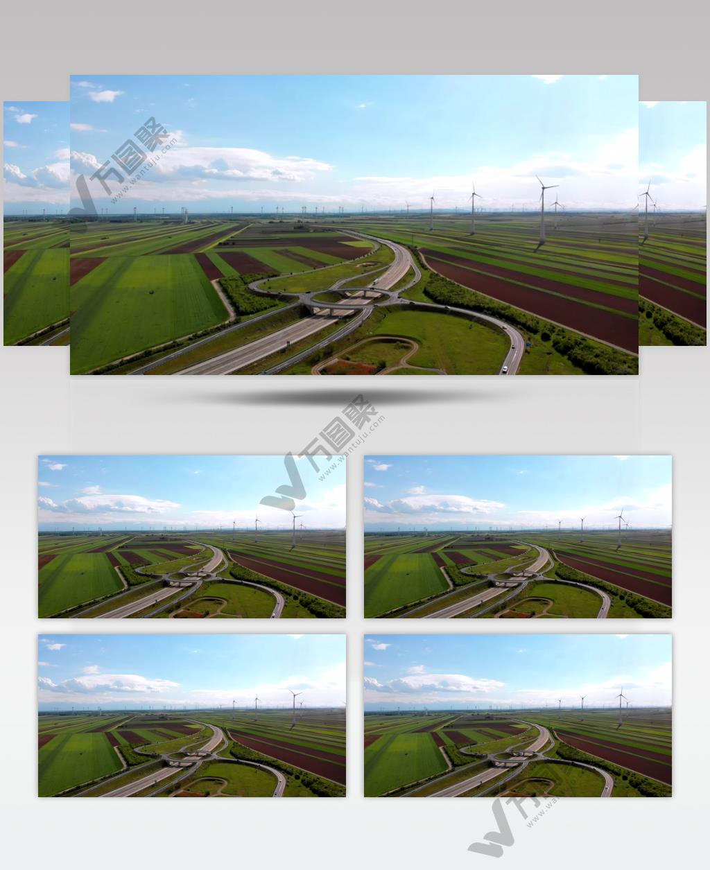 蓝天白云下田野中风力发电高速公路美景视频