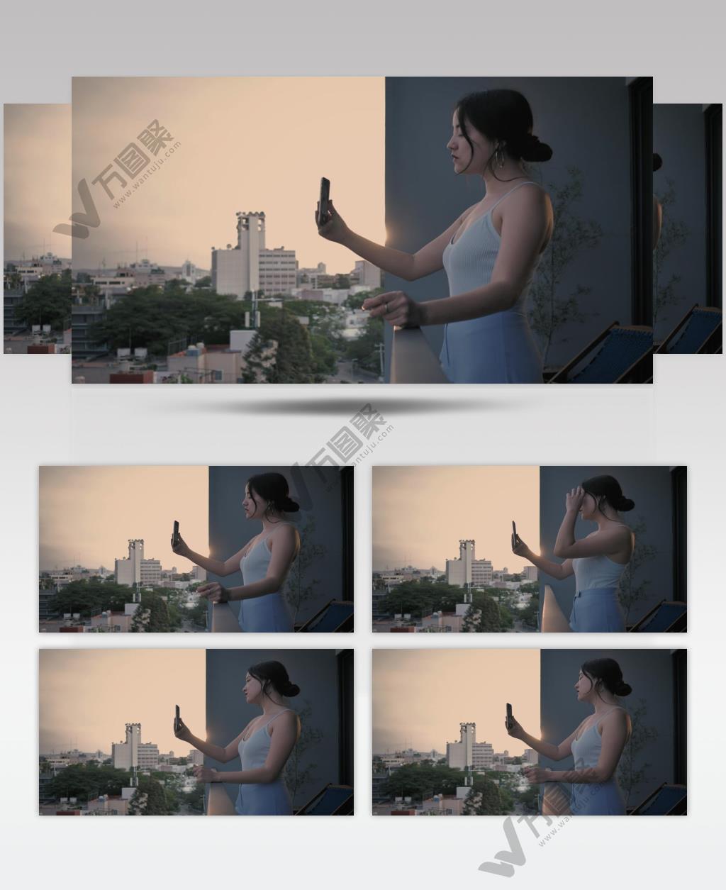 日落夕阳下站在阳台上视频通话的女孩