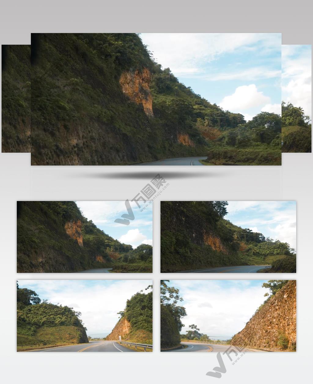 实拍行驶在山脉中间的一条公路自然美景