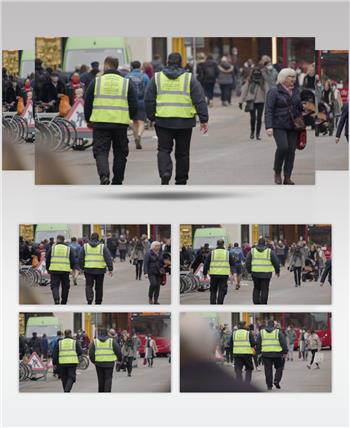 长镜头看英国牛津市一条繁忙的街道上的政府服务人员