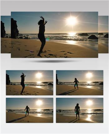 慢镜头实拍一位男性在沙滩上表演旋转和后翻