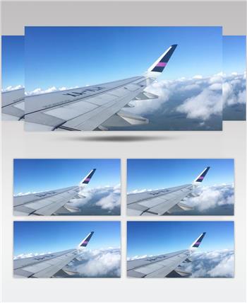  航拍镜头窗外一架飞越云层的飞机