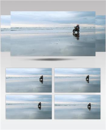几个在海边沙滩上骑摩托车旅游的人