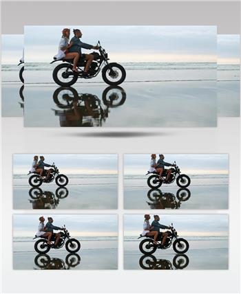 在海滩上骑摩托车的情侣