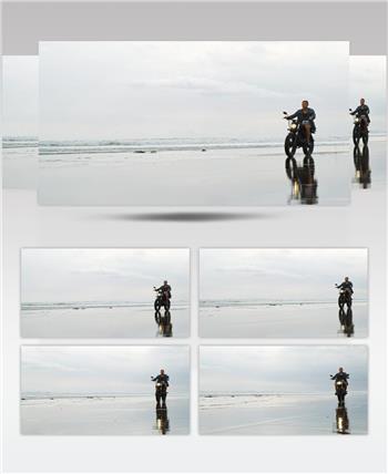 在海滩上骑摩托车的男子