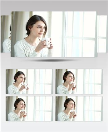 年轻女子在阳光明媚的窗户旁饮茶