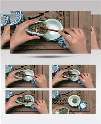 向茶杯里放入茶叶沏茶