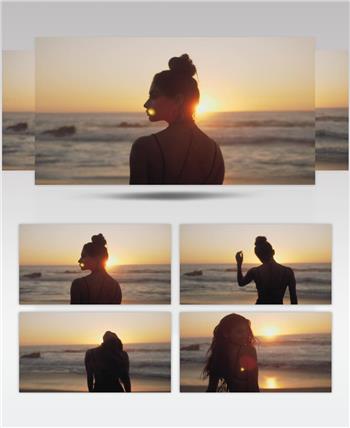 日落夕阳下美女走向大海海滩