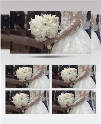 实拍美丽的新娘在婚礼上手捧花束