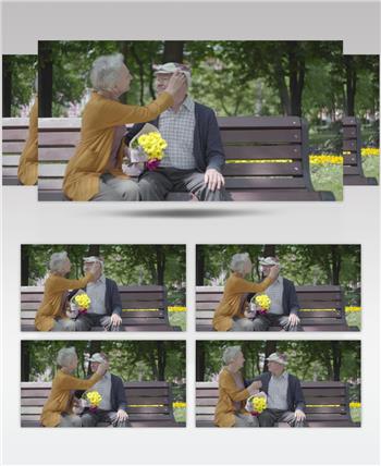 一对老夫妇坐在公园的长凳上