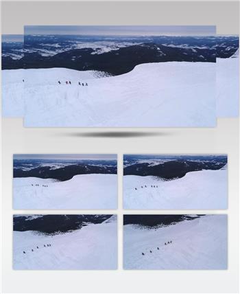 航拍滑雪爱好者在雪地里行走实拍视频