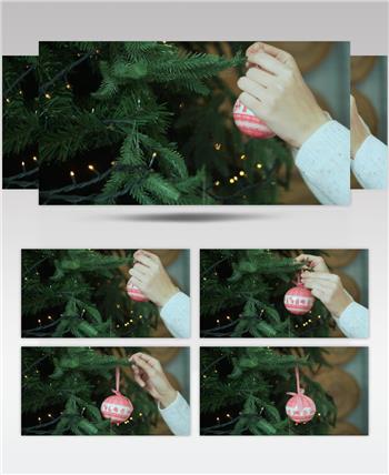 圣诞节给圣诞树挂装饰视频