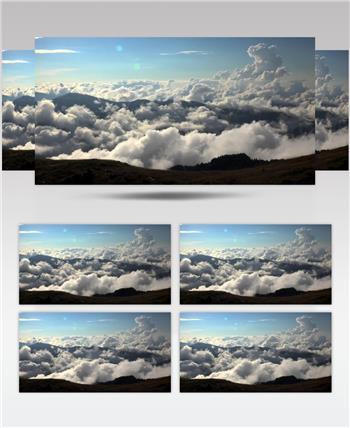 蓝色天空下的山脉云雾缭绕美景视频
