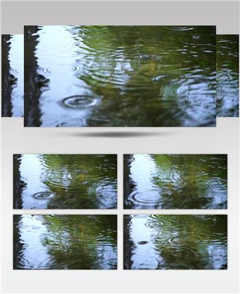 慢摄特写雨滴落在湖面上溅起水波视频素材