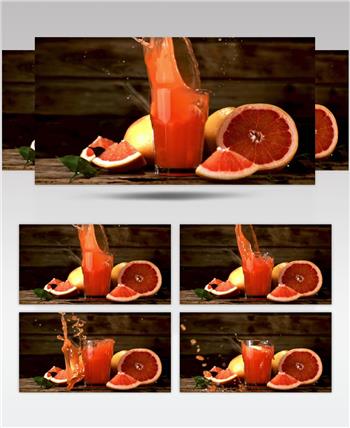 慢动作血橙落在一杯果汁里