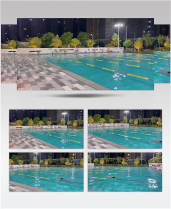 实拍小区游泳池晚上游泳特拍