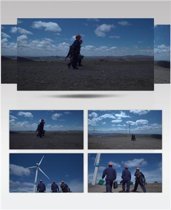 风电工程师拿着修理工具走向风车