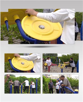 小区居民在健身器材上锻炼身体