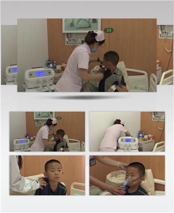 儿科病房护士给孩子用设备治疗肺炎