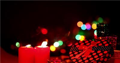 圣诞节情人节燃烧的红色蜡烛礼物盒视频